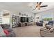 Inviting living room with neutral colors, plush carpeting, and a stylish ceiling fan at 2839 S Copperwood --, Mesa, AZ 85212