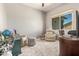 Bright office space featuring a plush rug, neutral tones, and comfortable seating under a ceiling fan at 2839 S Copperwood --, Mesa, AZ 85212