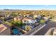 Aerial view of a beautiful home with a large pool, patio, and well-manicured yard in a desirable neighborhood at 28408 N 52Nd Way, Cave Creek, AZ 85331