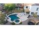 Aerial view of a backyard with a pool, playground, and outdoor seating at 28408 N 52Nd Way, Cave Creek, AZ 85331