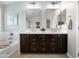 Bathroom featuring a soaking tub and dual sinks with white marble countertops at 28408 N 52Nd Way, Cave Creek, AZ 85331