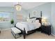 Bright primary bedroom with light blue walls, neutral carpet and chandelier at 28408 N 52Nd Way, Cave Creek, AZ 85331