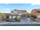 Inviting two-story home showcasing a well-manicured front yard and a welcoming entryway at 28408 N 52Nd Way, Cave Creek, AZ 85331