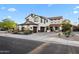 A desirable two-story home featuring a spacious driveway, three-car garage, desert landscaping, and inviting curb appeal at 28408 N 52Nd Way, Cave Creek, AZ 85331