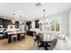 Spacious kitchen with island seating, stainless appliances, and adjacent dining area with banquette at 28408 N 52Nd Way, Cave Creek, AZ 85331