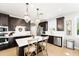 Gourmet kitchen with stainless appliances, a spacious island, and pendant lighting at 28408 N 52Nd Way, Cave Creek, AZ 85331