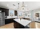 Bright eat-in kitchen features stainless steel appliances, white quartz countertops, and wood floors at 28408 N 52Nd Way, Cave Creek, AZ 85331