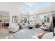 Bright living room boasts soaring ceilings, plantation shutters, and plenty of comfortable seating at 28408 N 52Nd Way, Cave Creek, AZ 85331
