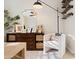 Cozy office space with a comfortable chair, decorative shelves, and a stylish floor lamp at 28408 N 52Nd Way, Cave Creek, AZ 85331