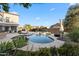 Resort-style backyard features a custom pool, lush landscaping, and a patio for outdoor entertaining at 28408 N 52Nd Way, Cave Creek, AZ 85331