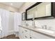 Stylish bathroom featuring a double vanity with modern fixtures and a subway tile shower at 3105 E Amber Ridge Way, Phoenix, AZ 85048