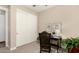Bright bedroom featuring a desk, closet, and neutral color palette at 3105 E Amber Ridge Way, Phoenix, AZ 85048