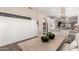 Inviting dining space with decorative accents, stylish seating, and a glimpse into the modern kitchen at 3105 E Amber Ridge Way, Phoenix, AZ 85048