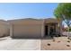 Single-story home boasting a spacious two-car garage, covered entryway, and neutral-toned exterior at 3105 E Amber Ridge Way, Phoenix, AZ 85048