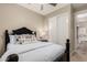 Inviting guest bedroom featuring a comfortable bed, closet, and access to the main bathroom at 3105 E Amber Ridge Way, Phoenix, AZ 85048