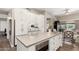 Bright kitchen features an island with built-in microwave and expansive counter space, perfect for cooking and entertaining at 3105 E Amber Ridge Way, Phoenix, AZ 85048