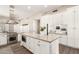 Modern kitchen features an island, stainless steel appliances, ample cabinet space, and sleek finishes at 3105 E Amber Ridge Way, Phoenix, AZ 85048