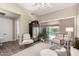 Inviting living room boasts neutral tones, stylish furnishings, and backyard access, creating a serene retreat at 3105 E Amber Ridge Way, Phoenix, AZ 85048