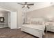 This main bedroom features wood-look floors and neutral paint to create a relaxing retreat at 3105 E Amber Ridge Way, Phoenix, AZ 85048