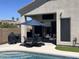 Outdoor patio with dining set, lounge chairs, and a built-in tv, extending indoor living space at 3105 E Amber Ridge Way, Phoenix, AZ 85048