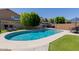 Sparkling pool area featuring lush green grass and comfortable lounge chairs at 3105 E Amber Ridge Way, Phoenix, AZ 85048