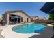 Beautiful backyard pool with surrounding patio and a built-in barbeque at 3105 E Amber Ridge Way, Phoenix, AZ 85048