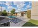 Tranquil backyard with a pool, lounging area, and grill, designed for comfortable outdoor living and entertaining at 3202 N 21St St, Phoenix, AZ 85016