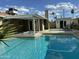 Backyard pool with covered patio and outdoor shed, offering a versatile space for relaxation and storage at 3202 N 21St St, Phoenix, AZ 85016