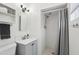 Well-lit bathroom featuring neutral gray vanity and shower at 3202 N 21St St, Phoenix, AZ 85016