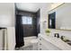 Modern bathroom with stylish black tiles in the shower and beautiful patterned floors at 3202 N 21St St, Phoenix, AZ 85016