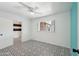 Charming bedroom showcasing patterned flooring, a ceiling fan, and a window with natural light at 3202 N 21St St, Phoenix, AZ 85016