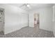 A bright bedroom with a patterned floor, closet, and an open doorway to an adjacent room at 3202 N 21St St, Phoenix, AZ 85016