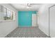 This bedroom features a unique patterned floor and a pop of color with an accent wall at 3202 N 21St St, Phoenix, AZ 85016