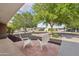 Welcoming brick front porch with chairs invites relaxation and offers a view of the surrounding neighborhood at 3202 N 21St St, Phoenix, AZ 85016