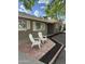 Charming front porch with two chairs and meticulous landscaping enhance this home's curb appeal at 3202 N 21St St, Phoenix, AZ 85016