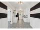Bright kitchen boasts white cabinetry, modern appliances, and a stylish decorative tile floor at 3202 N 21St St, Phoenix, AZ 85016
