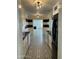 Galley kitchen with white cabinets, black countertops, and patterned tile flooring at 3202 N 21St St, Phoenix, AZ 85016