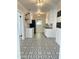 Bright kitchen featuring white cabinetry, black countertops, and black and white flooring at 3202 N 21St St, Phoenix, AZ 85016