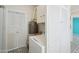 Bright laundry room with tiled floor, white cabinetry, and a washer and dryer at 3202 N 21St St, Phoenix, AZ 85016