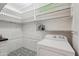 Laundry room with black-and-white mosaic tile and white-painted brick walls at 3202 N 21St St, Phoenix, AZ 85016