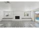 Bright living room boasts a decorative fireplace, and unique patterned floors at 3202 N 21St St, Phoenix, AZ 85016