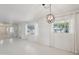 Spacious living room enhanced by natural light, modern lighting, and adjacent rooms for entertaining at 3202 N 21St St, Phoenix, AZ 85016