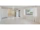 Bright living room features fresh white paint, natural light, and seamless transition to adjoining space at 3202 N 21St St, Phoenix, AZ 85016