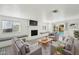Cozy living room features a brick fireplace and sliding glass doors to backyard pool at 3202 N 21St St, Phoenix, AZ 85016