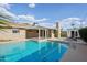 Inviting backyard with a refreshing pool and covered patio, offering a perfect space for outdoor enjoyment at 3202 N 21St St, Phoenix, AZ 85016