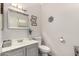 A clean bathroom features a framed mirror, decor and a white toilet at 337 N 103Rd Pl, Apache Junction, AZ 85120