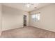 Beige bedroom with a window, carpet, and a walk-in closet at 337 N 103Rd Pl, Apache Junction, AZ 85120