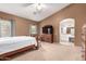 Primary bedroom features natural light, carpet, and a wood-framed bed at 337 N 103Rd Pl, Apache Junction, AZ 85120