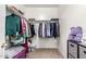 A walk-in closet has rods and shelves to maximize storage at 337 N 103Rd Pl, Apache Junction, AZ 85120