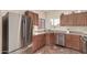 Sunlit kitchen with stainless steel appliances and brick flooring at 337 N 103Rd Pl, Apache Junction, AZ 85120
